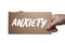 Word ANXIETY written on cardboard. Clipping path