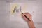 The Word ART sketched on paper with real human hand