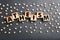 Word Atheism made of wooden cubes with letters on grey table, flat lay