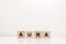 Word aura lettering on wooden blocks