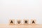 Word aura lettering on wooden blocks