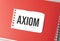 The word axiom on torn paper on red notepad
