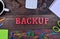 The word Backup on table