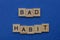 Word bad habit made from brown wooden letters