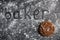The word Baker written on a gray black background of stones sprinkled with flour in large letters