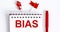 The word BIAS is written in the notebook with office tools