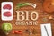 Word BIO ORGANIC in wooden letters with many cooking ingredients
