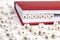 Word Bitcoin written in wooden blocks in red notebook on white w