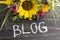 Word Blog with Summer Flowers on a Rustic Wooden Background