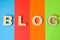 Word Blog of volumetric letters is background of four colors: blue, red, orange and green. Visualizing concept of blog as site or