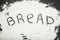 The word `bread` is written in flour.