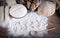 Word \'bread\' written on flour scattered on wooden table