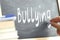 The word Bullying hand written on a blackboard.