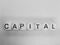 Word capital spelled on dice