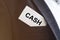 Word cash inscription on paper card in pocket of businessman suit