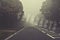 Word cataracts written on foggy, blurred road, danger autumn road