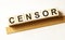 Word CENSOR made with wood building blocks