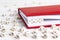 Word Chat written in wooden blocks in red notebook on white wood