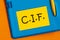 The word CIF-Cost, Insurance and Freight-an acronym on yellow paper