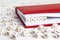 Word Coach written in wooden blocks in red notebook on white woo