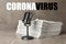 Word CORONAVIRUS, newspapers and microphone on marble table. Journalist`s work