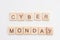 Word CYBER MONDAY made from wooden cubes on white. Selective focus