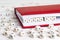 Word Cyber war written in wooden blocks in red notebook on white