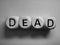 Word dead spelled on dice