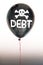 The word debt in white and a skull and cross bones on a balloon illustrating the concept of a debt bubble