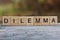 Word dilemma made of wooden letters