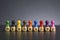 Word DIVERSITY written on wooden cubes with pawns in various colors