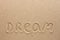 The word dream written on the sand