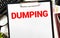 The word dumping on a white background with a yellow folder