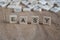 The word easy written with cube letters on wood background