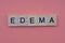 Word edema from small gray wooden letters