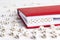 Word Empathy written in wooden blocks in red notebook on white w