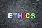 word ethics spell using colorful alphabets block