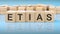 word etias made with wood building blocks, business concept