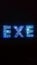 The word `exe` written with decorative metal letters, black backward, macro