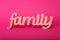 Word family, wooden letters on pink paper background. Love and unity concept.