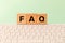 The word FAQ Frequently asked questions, used on the Internet, in online stores or offices, answering standard queries, Inscriptio