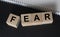 Word fear inscription. Concept of being afraid and feeling anxiety