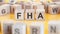 Word FHA written on wood blocks, concept