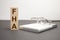 the word FHA is written on wooden cubes on a gray background. close-up of wooden elements, magnifying glass, paper documents and