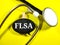 Word FLSA & x28;Fair Labour Standards Act& x29; on black board with stethoscope on yellow background.Medical concept.
