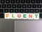 Word Fluent on keyboard background