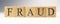 The word Fraud was created from wooden cubes. finance and economy.