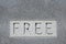 The word Free on stone.