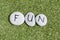 Word fun written in pebbles on artificial grass