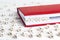 Word Funding written in wooden blocks in red notebook on white w